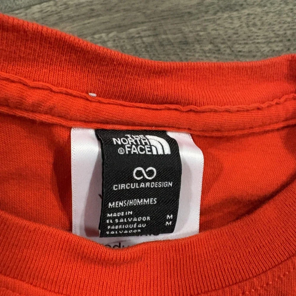 The North Face Shirt Mens Medium Orange Long Sleeve Graphic Circular Design